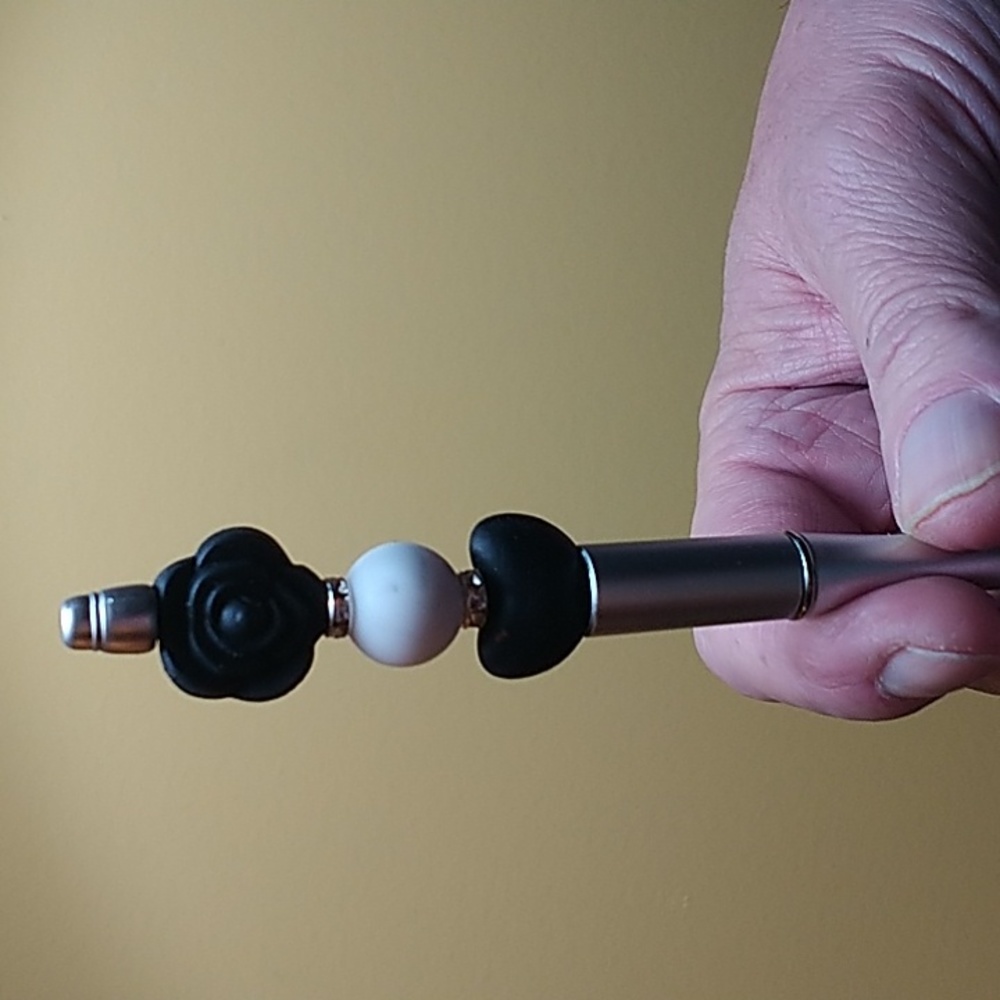 Beaded pen...Silver refillable pen with black accents.